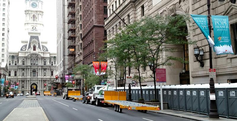 philadelphia pope francis visit planning with a row of porta potties on the side of the road