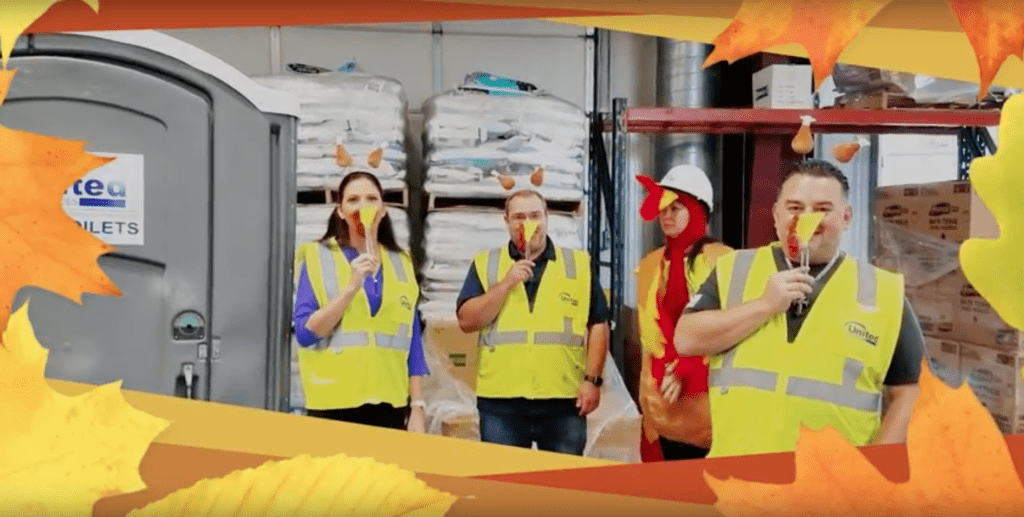 4 workers wearing safety vests celebrating thanks giving